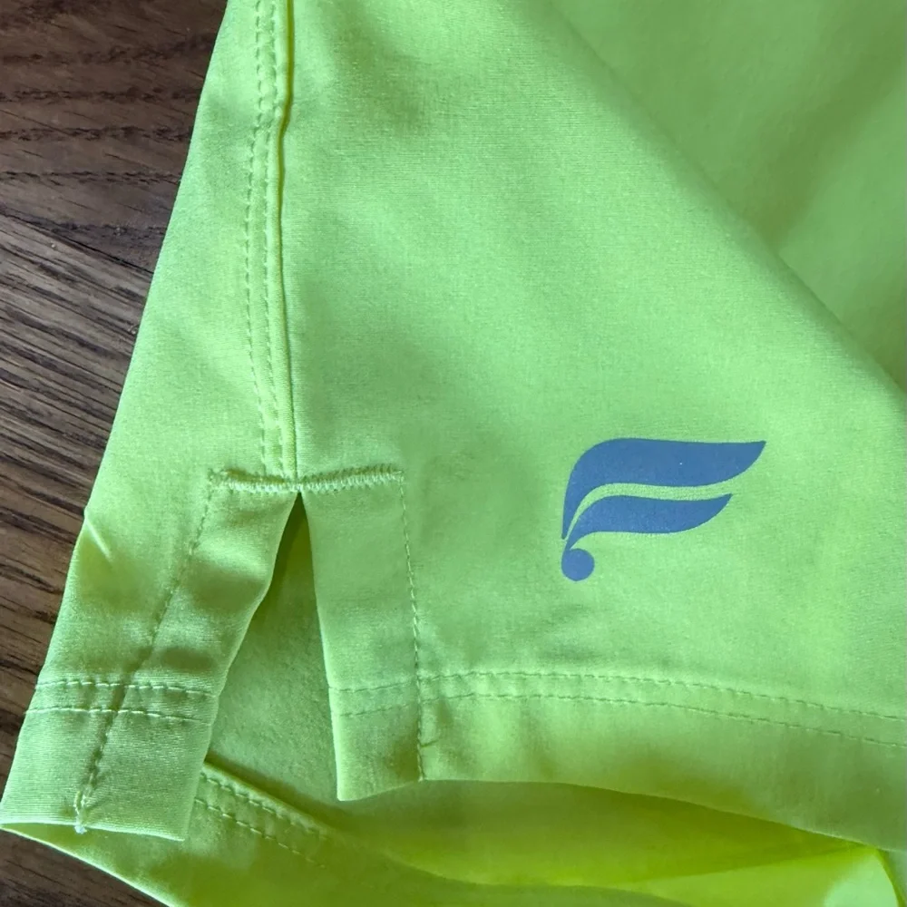 Fabletics. 7 inch Universal Tennis Fundamental Short. Highlighter Yellow. XS